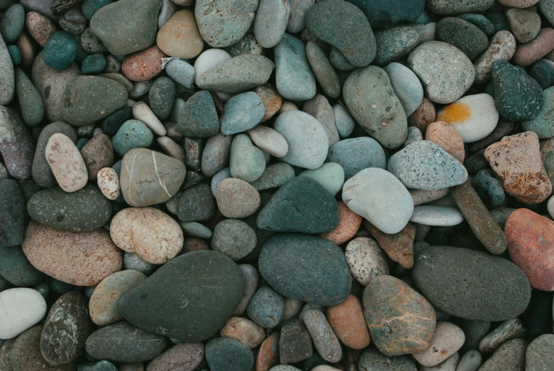 a bunch of small rocks that are all different colors