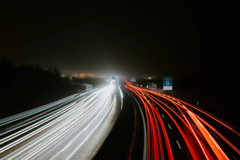 a highway is shown at night with blurry lights