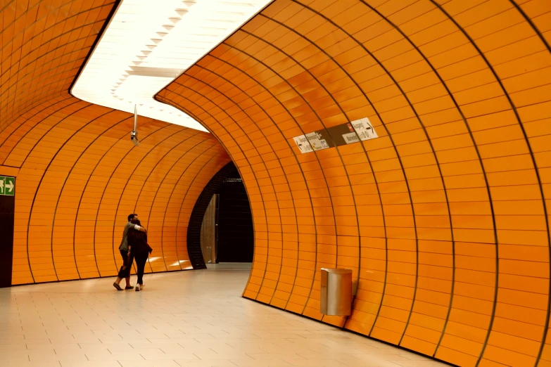 the large orange tunnel is next to a person