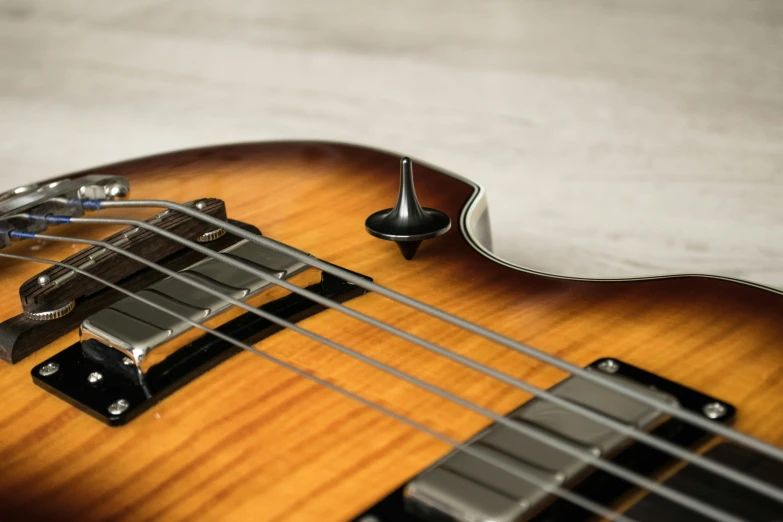 a close up of a guitar strings and the headstock