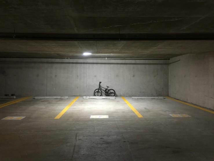 a parking area with a motorcycle parked inside