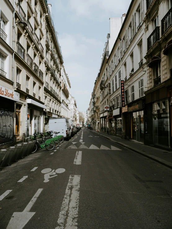 some vehicles are parked on the side of the street