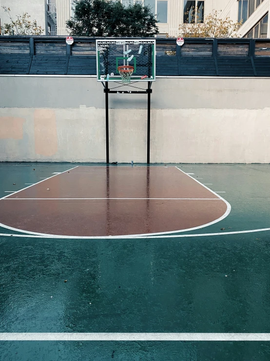 basketball court with metal guard during day time