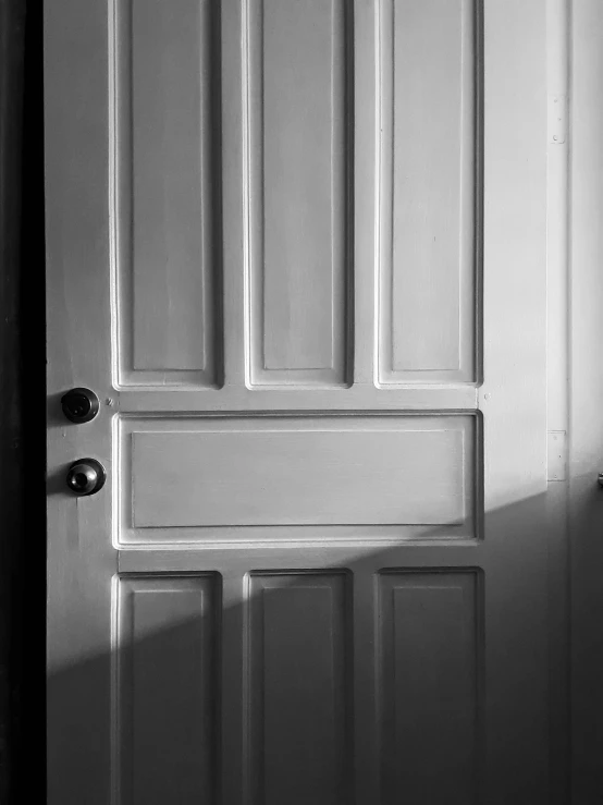 a black and white po of an open door