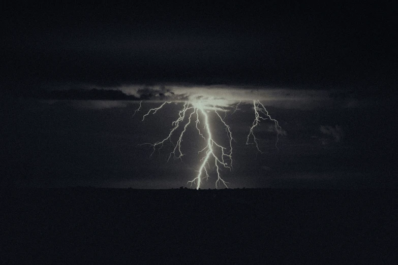 lightning strikes in a dark sky on a black night