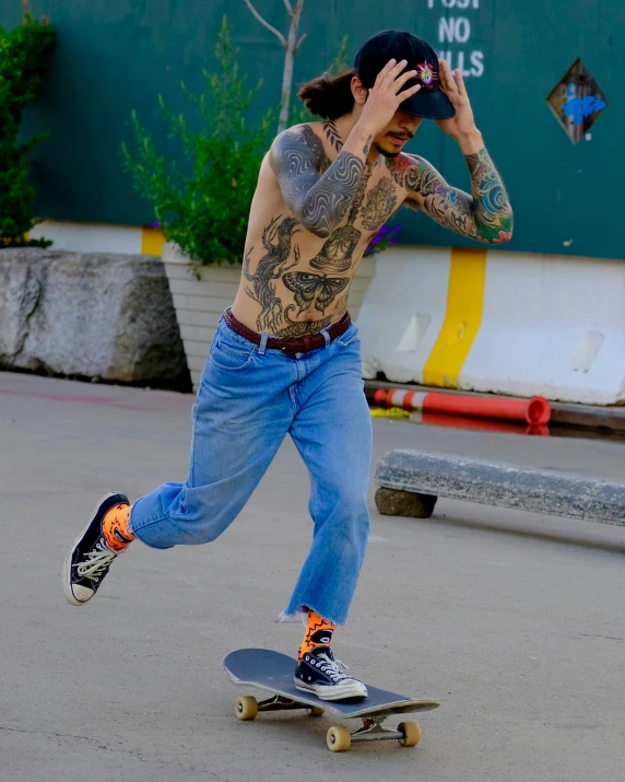 a man riding a skateboard in the street