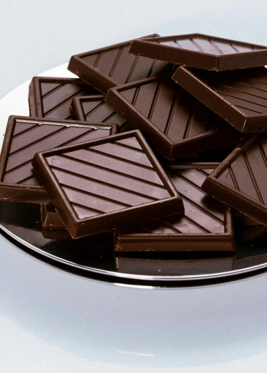 several chocolate bars on a plate on top of a table