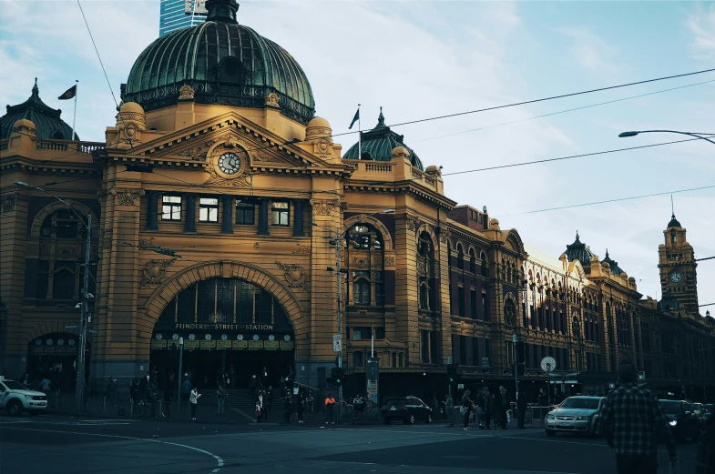 an ornate building with domes and steeples in the city