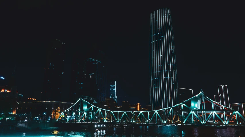 a large city with buildings and bridges in the night