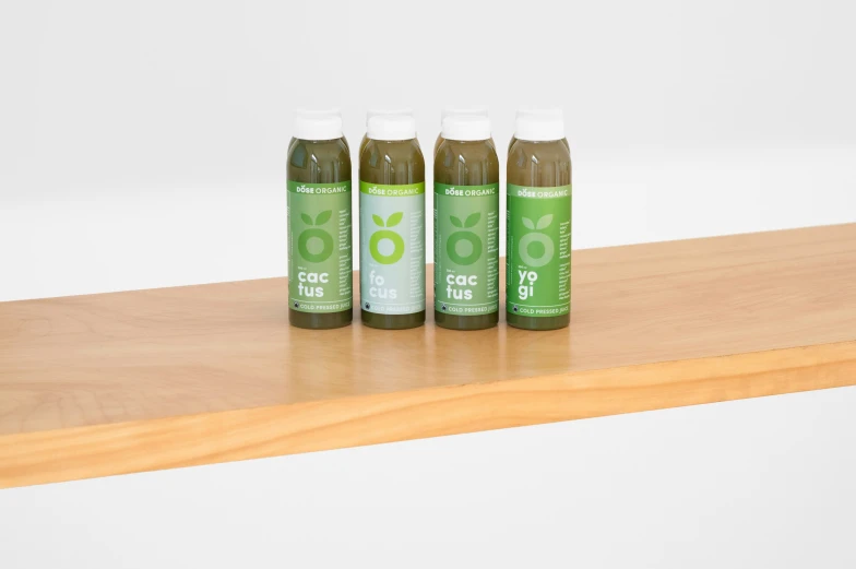 three bottles of go green sit on a shelf