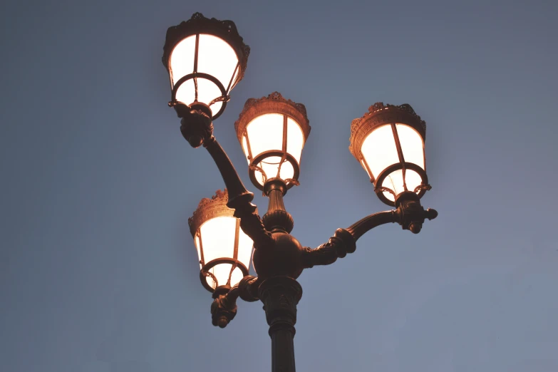 a street light with three lights at the top