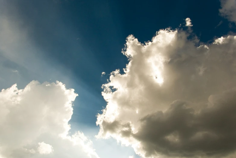 a large group of white clouds with a blue sky