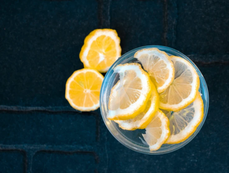 a glass of lemonade has three slices taken out of it