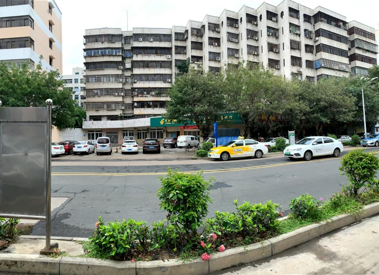 a group of buildings sitting on the side of a road