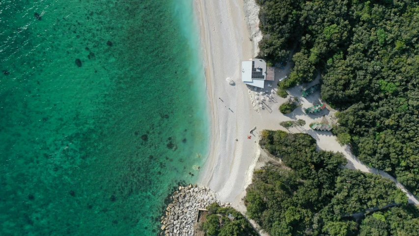 the clear blue water is an aerial view from above