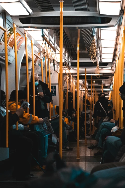 a crowded train car is seen in this image