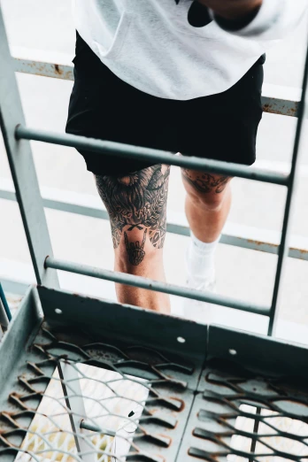 a person has some tattoo on their leg