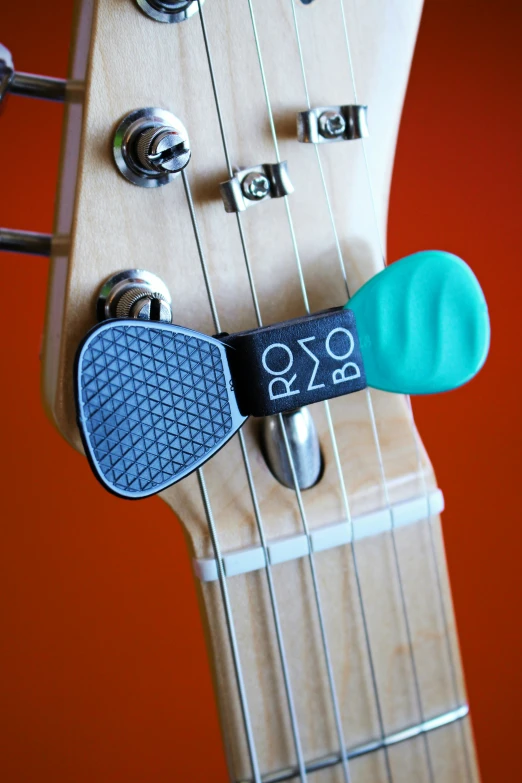 close up of a guitar's headset and strings