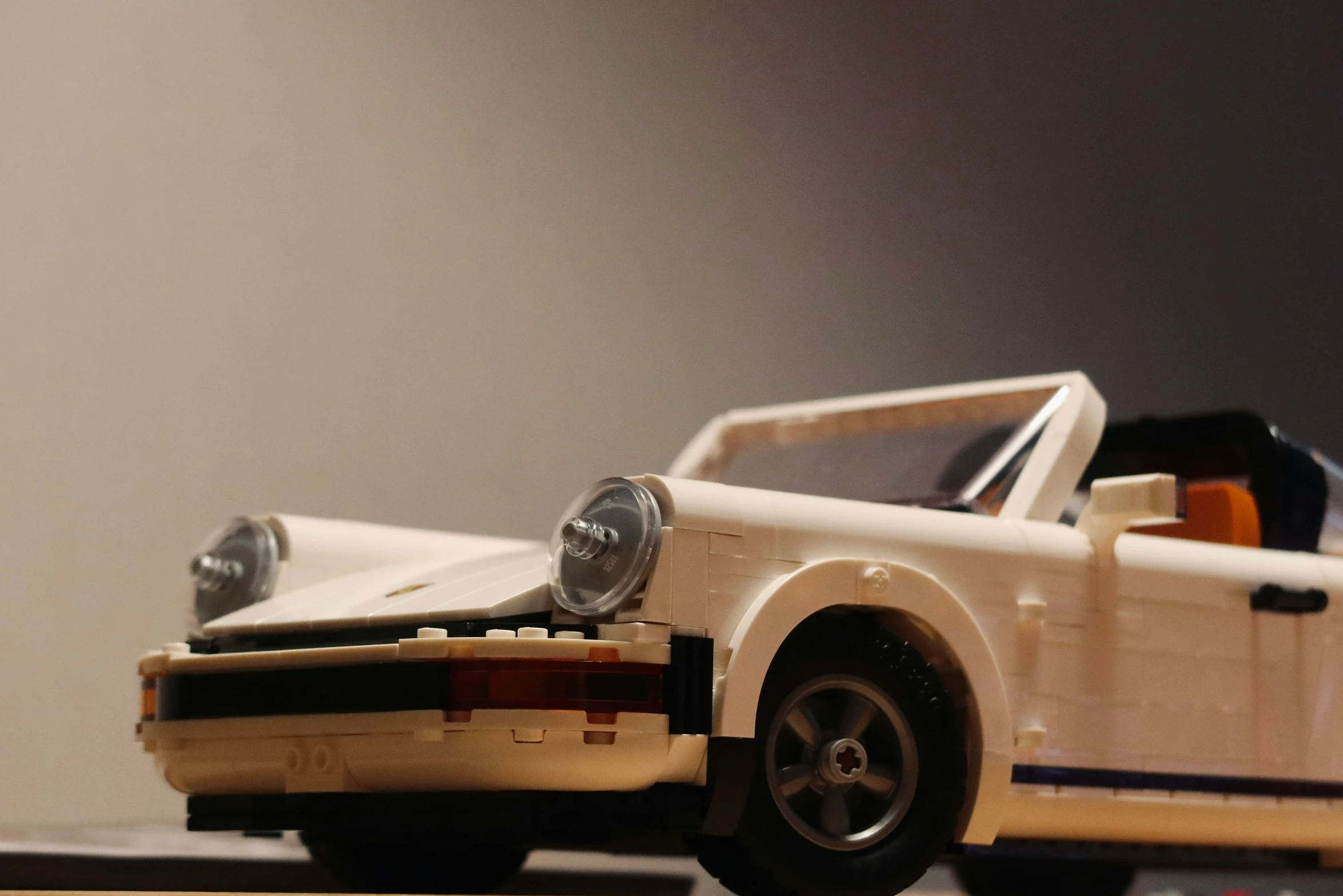 a toy car sitting on top of a table