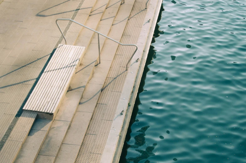 a boat ramp that is surrounded by water