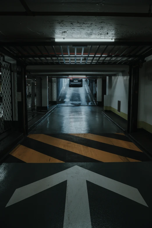 a parking garage with yellow and grey markings