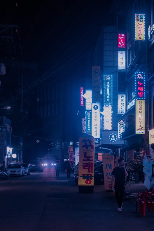 a view of a busy street in the middle of night