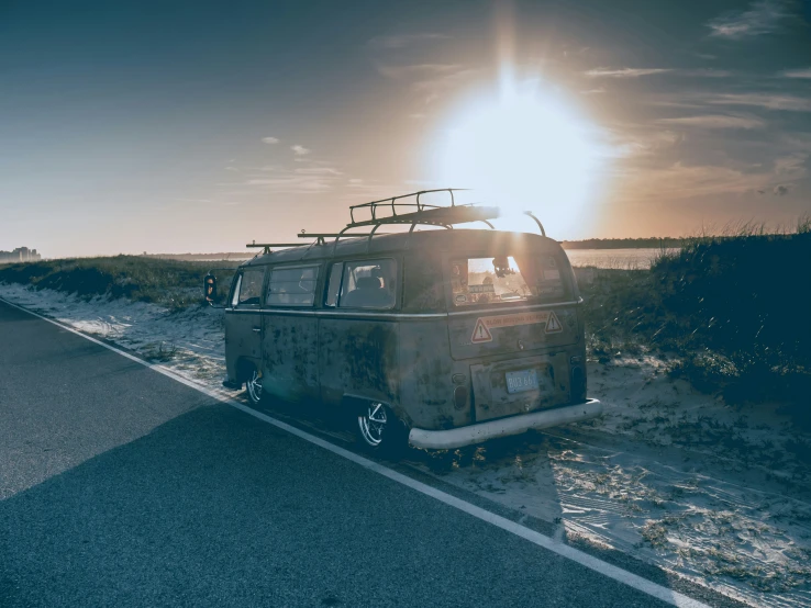 an old rusted van on the side of the road