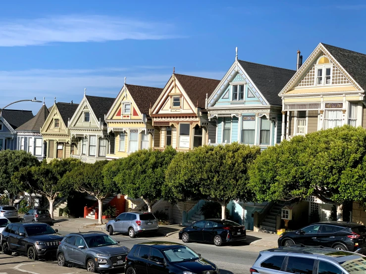 the street and some houses in front of trees