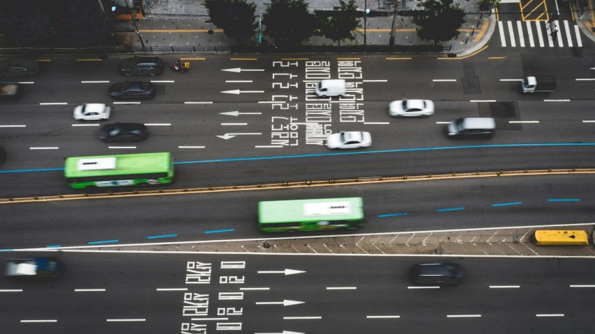 vehicles are traveling through an intersection in the city