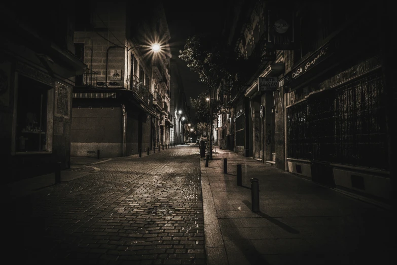 a man walking down a long dark street