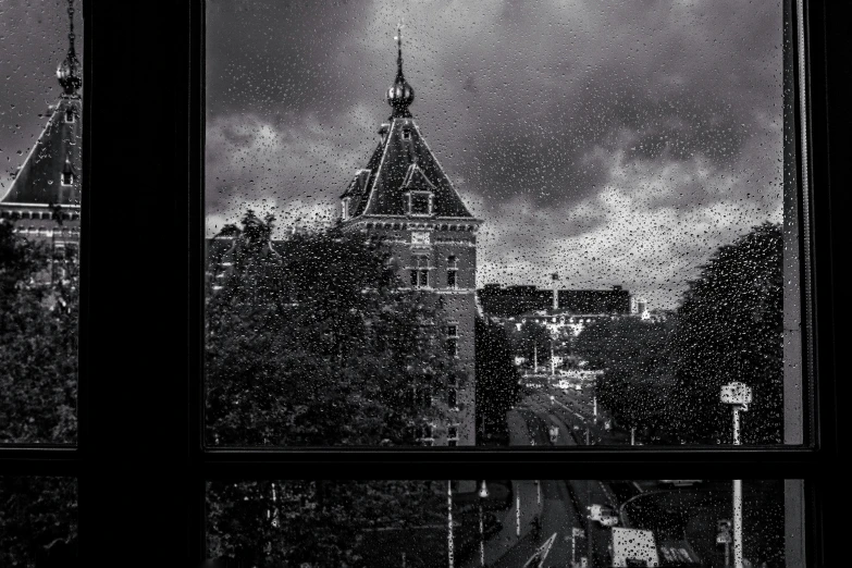 the view out of an office building window, looking towards a city