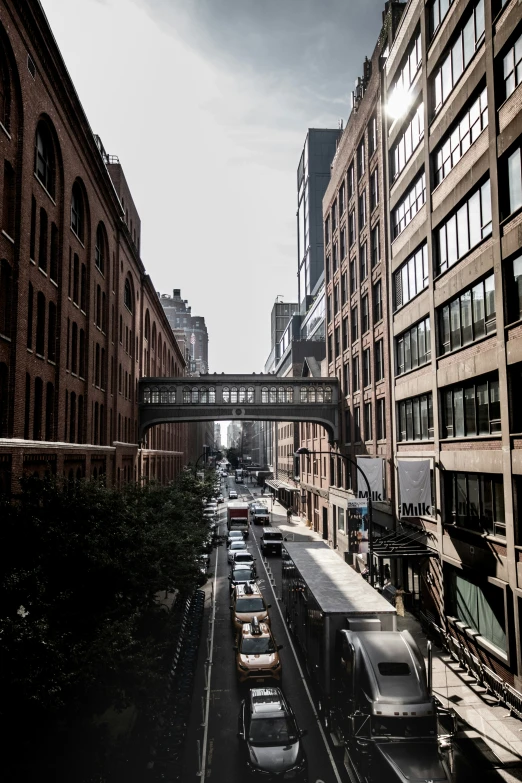 a very busy street with buildings and tracks