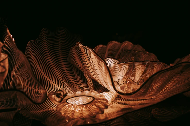 some very shiny metal wings with beads and rings