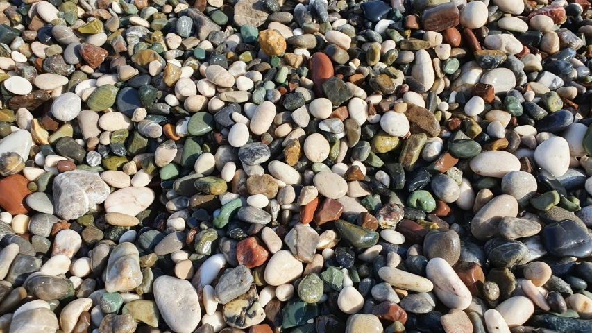 a bunch of small rocks and gravel next to each other