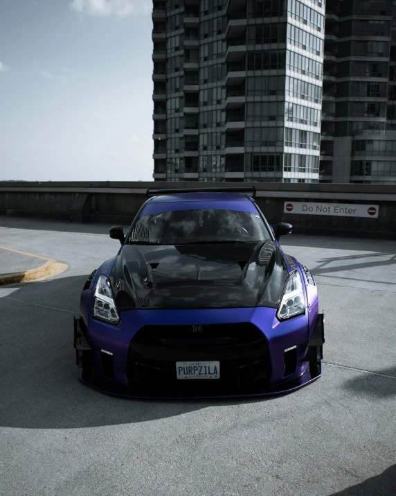 a blue nissan zr1 sports car on a city street