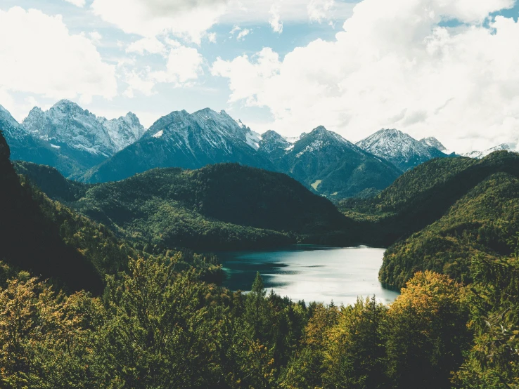 the mountains have some trees near by and water