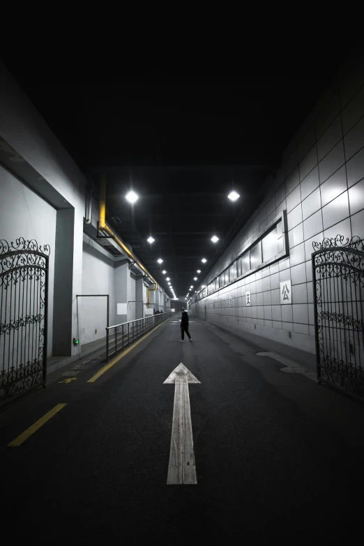 a person walks down the street at night