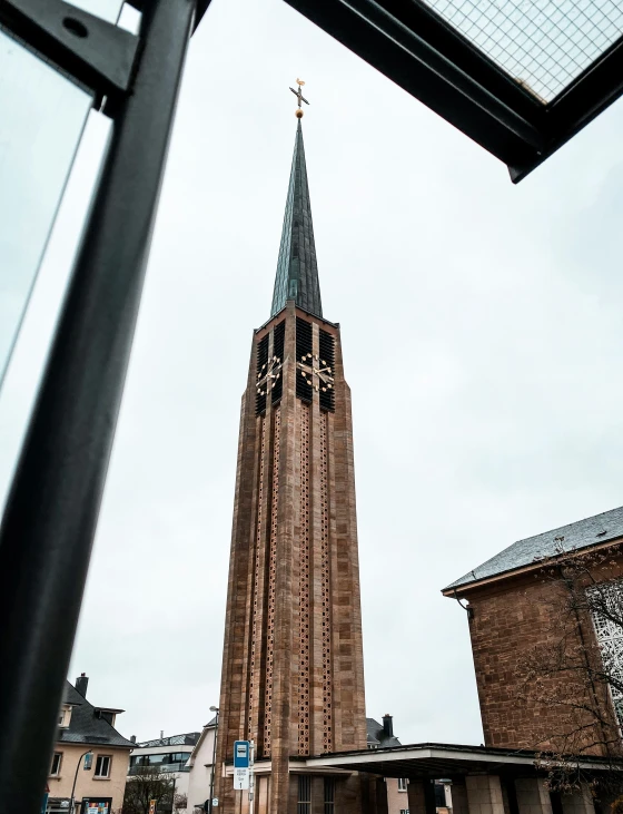 a church spire is seen from the inside of a bus