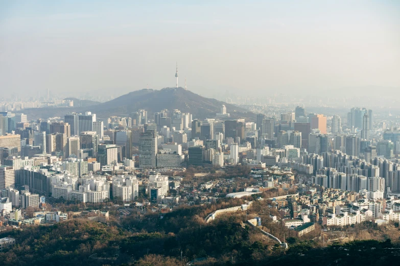 a cityscape overlooking a city with tall buildings