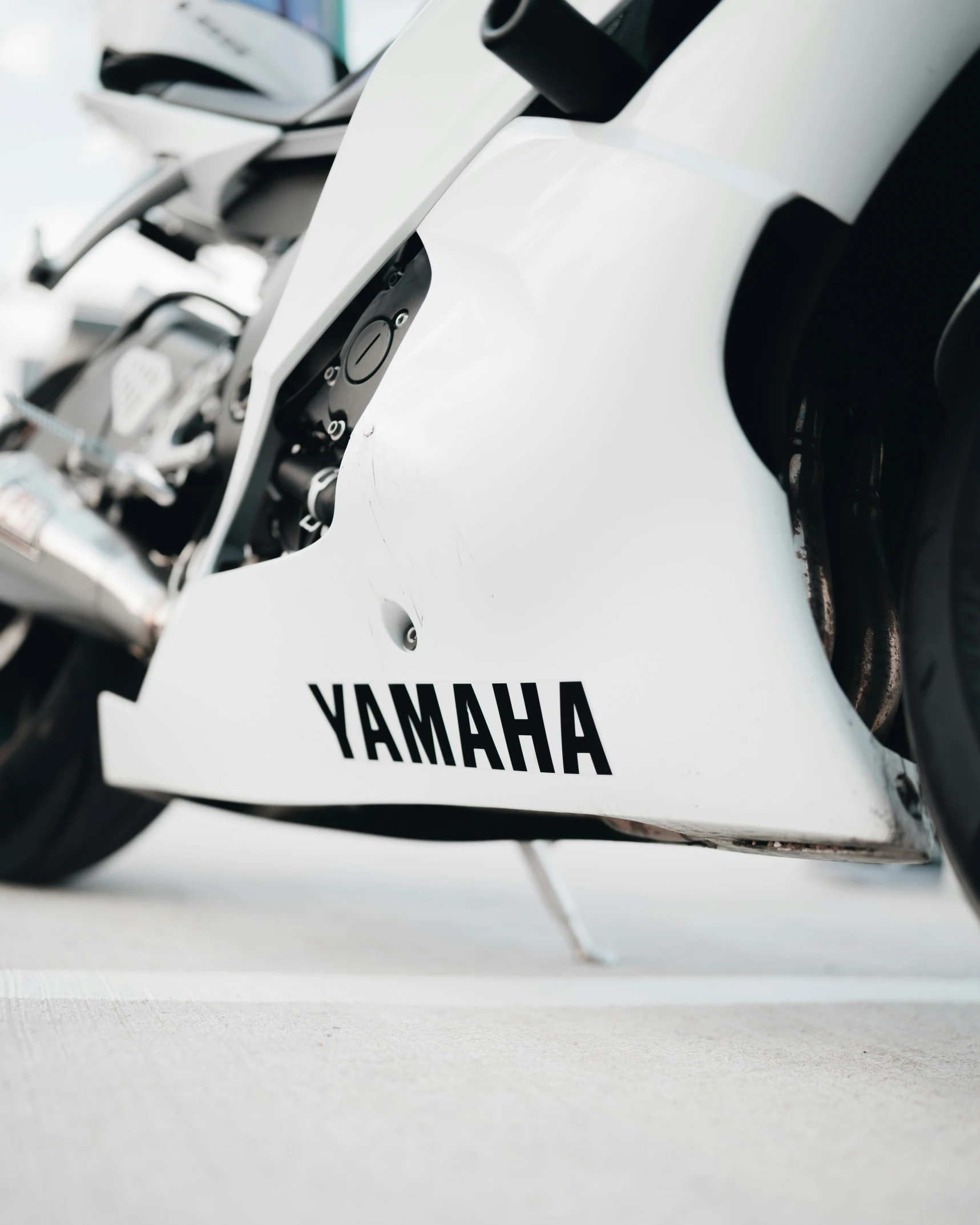 a close - up image of a motorcycle's front tire and fenders