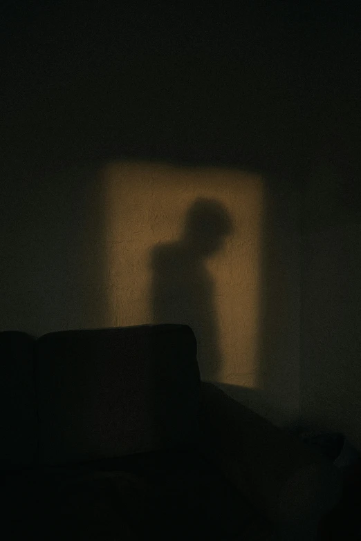 a woman looking to her left in the dark