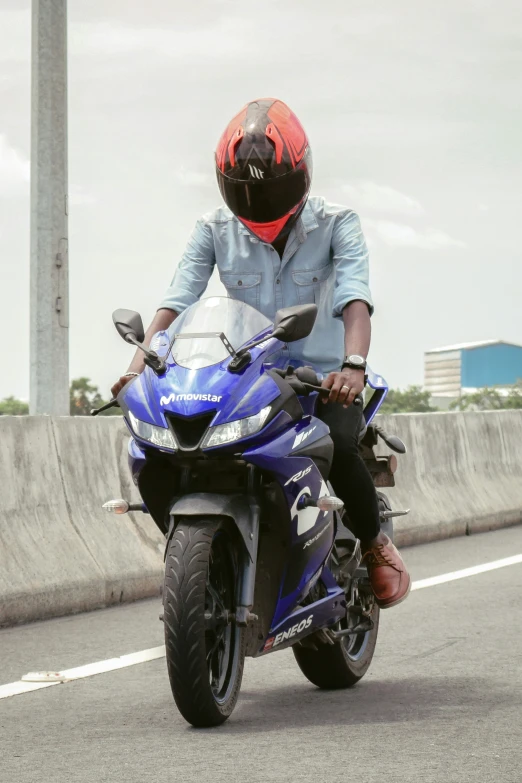 a person in a helmet on a motorcycle