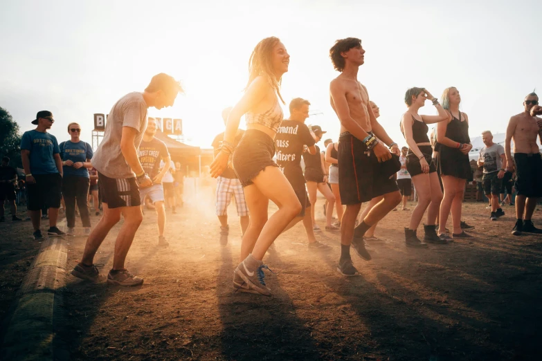 people are walking near each other in the sand