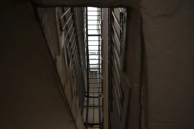 a stairway leading up an alley way to a building