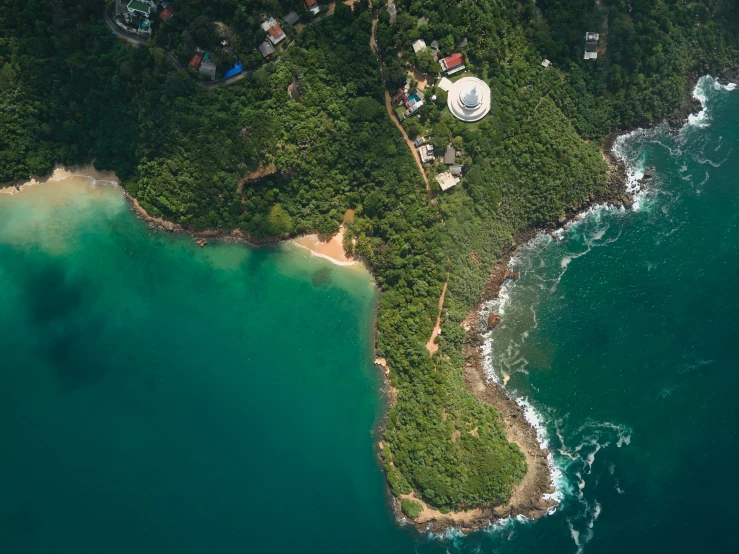 the view from above of a tropical ocean and the surrounding land