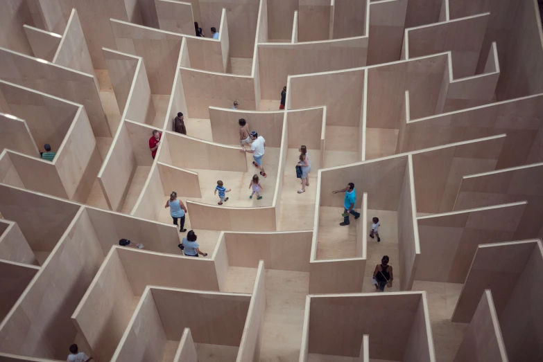 some people are walking around in an elaborate maze