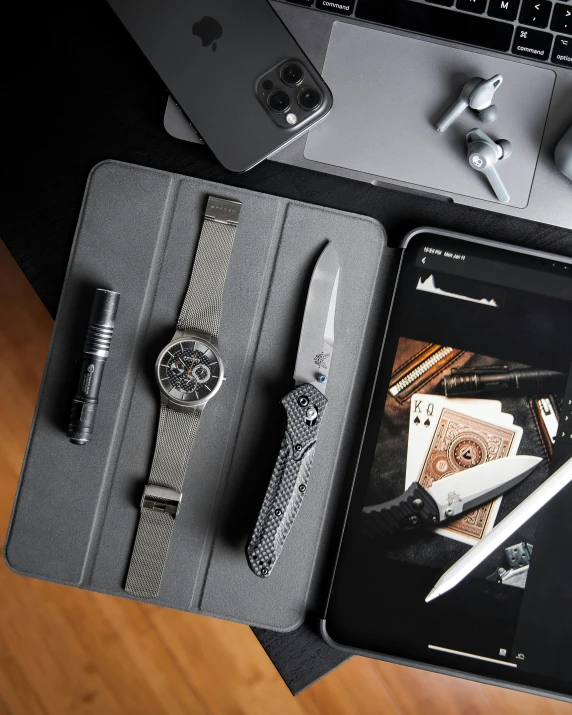 an assortment of accessories displayed in front of a laptop