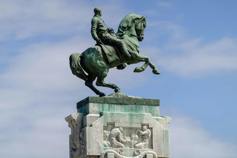 a statue of a man riding a horse, riding a horse