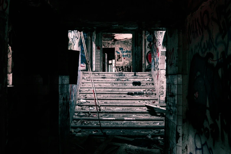 old rundown stairwell in dilapidated urban area with graffiti