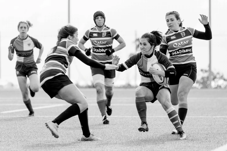 a group of women playing a game of soccer